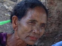tattooed face woman chin village