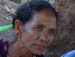 tattooed face woman chin village
